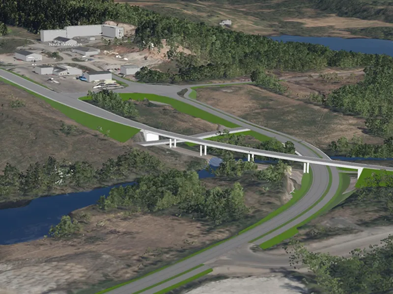 Bildet er en illustrasjon av hvordan den nye kryssløsningen ved Harstad/Narvik lufthavn Evenes skal se ut. Bildeteksten sier, Trygg og effektiv løsning: E10 skal legges på bru for å sikre planfri kryssing av adkomst til Harstad/Narvik lufthavn Evenes. Det skal også bygges en trygg vei for myke trafikanter mellom flyplassen og hotell og næringsarealet på andre siden av europaveien.